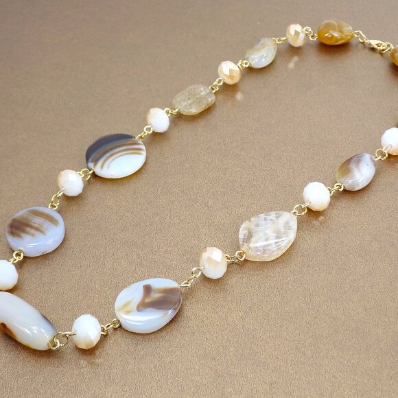 A mix of beige, brown, and off white bead necklace with glass and stone - Picture 12 of 13